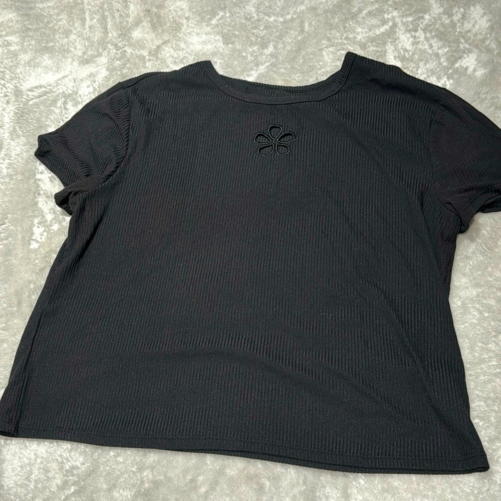 Black top with flower accent